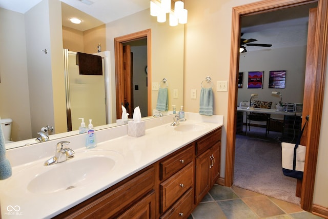 bathroom with walk in shower, vanity, tile patterned floors, and ceiling fan