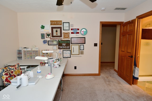 carpeted office with ceiling fan