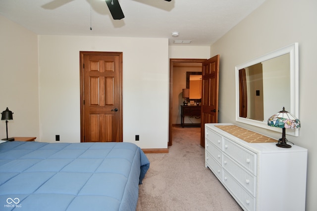 bedroom with light carpet and ceiling fan