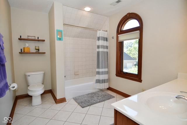 full bathroom featuring vanity, toilet, shower / bathtub combination with curtain, and tile patterned floors