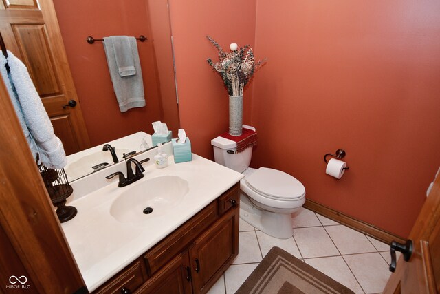 bathroom featuring vanity, toilet, and tile patterned floors