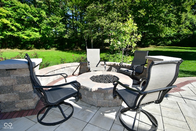 view of patio / terrace with an outdoor fire pit