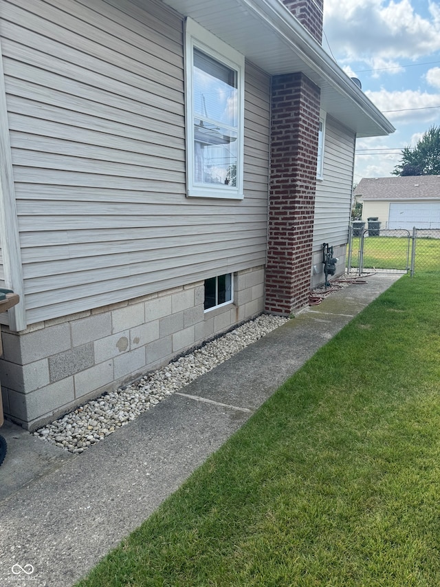 view of home's exterior with a yard