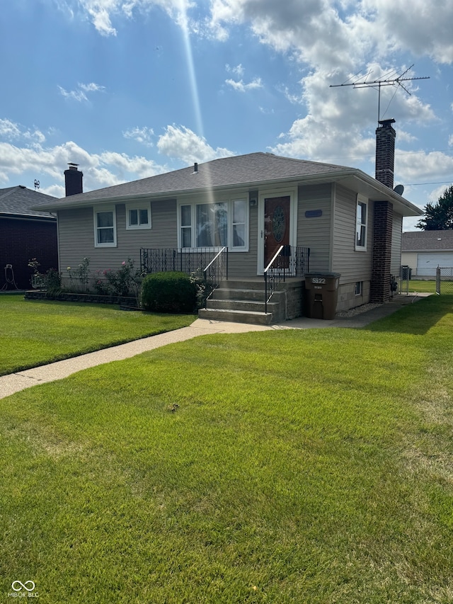 ranch-style home with a front lawn