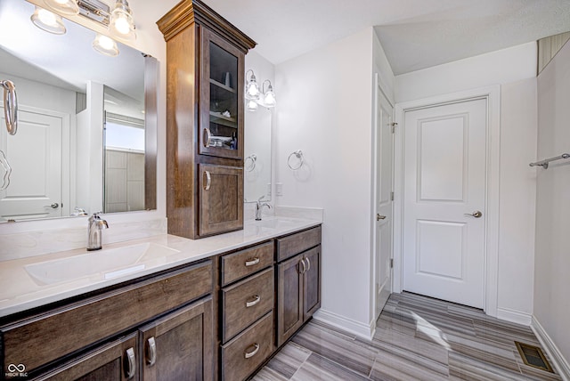 bathroom featuring hardwood / wood-style flooring and vanity