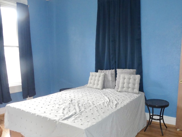 bedroom featuring hardwood / wood-style floors