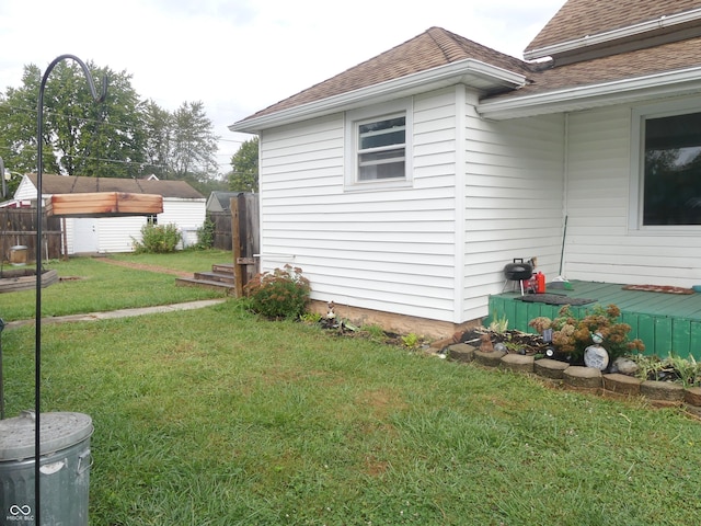 view of home's exterior with a lawn