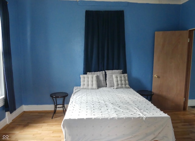 bedroom featuring hardwood / wood-style flooring