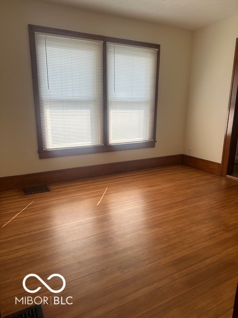 unfurnished room featuring light hardwood / wood-style floors