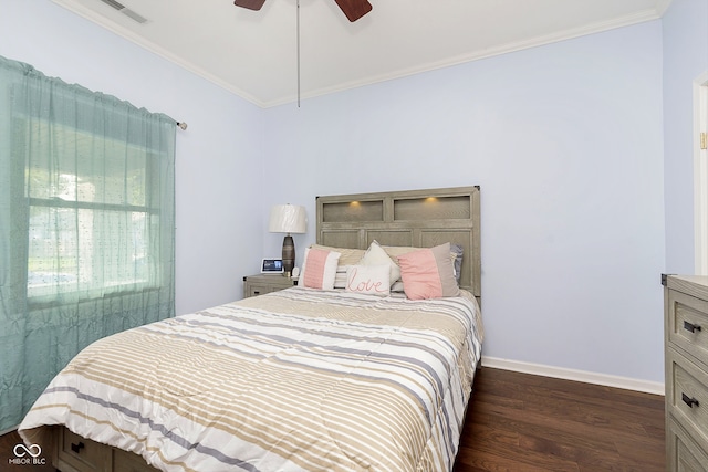 bedroom featuring crown molding, ceiling fan, and dark hardwood / wood-style flooring