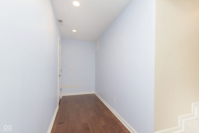 corridor featuring dark wood-type flooring