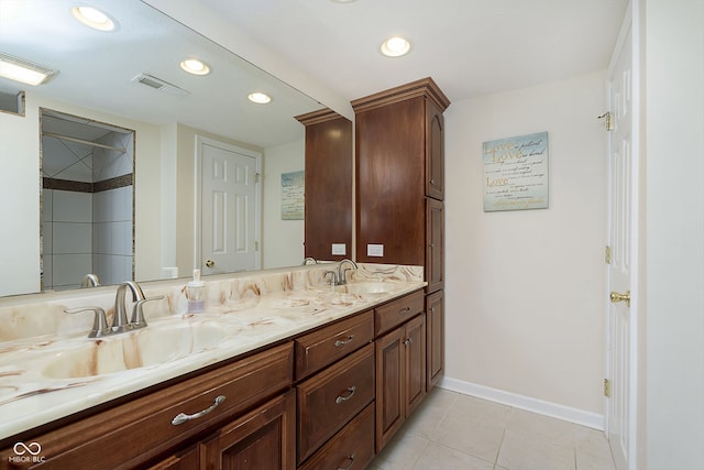 bathroom with tile patterned floors and vanity