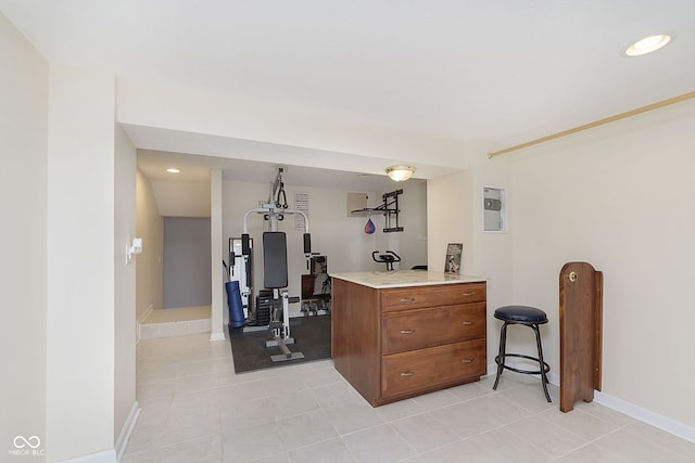 workout room with light tile patterned floors