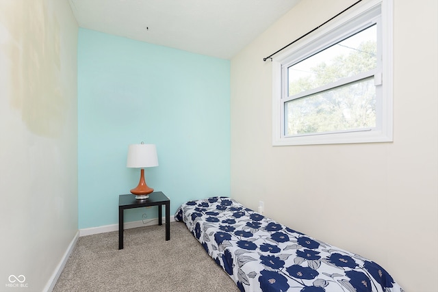 bedroom featuring light colored carpet