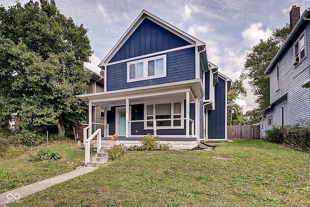 view of front of property featuring a porch and a front lawn