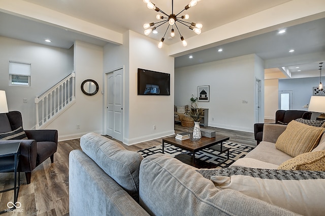 living room featuring a chandelier and hardwood / wood-style flooring