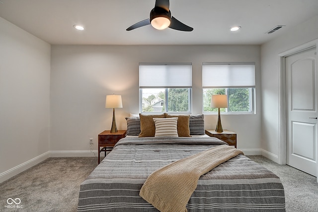 bedroom with light carpet and ceiling fan