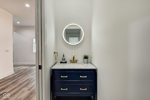 interior space with indoor wet bar and hardwood / wood-style floors