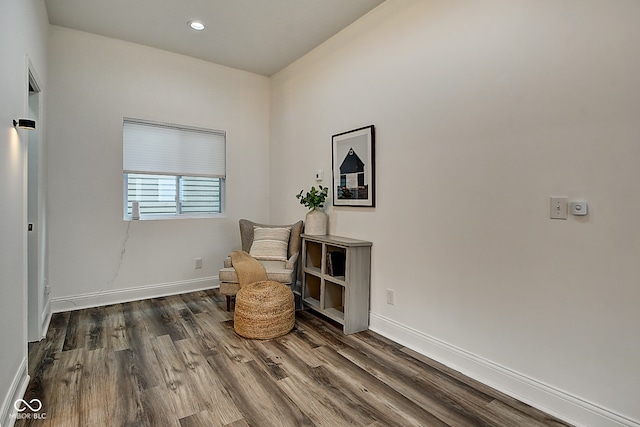 sitting room with dark hardwood / wood-style floors