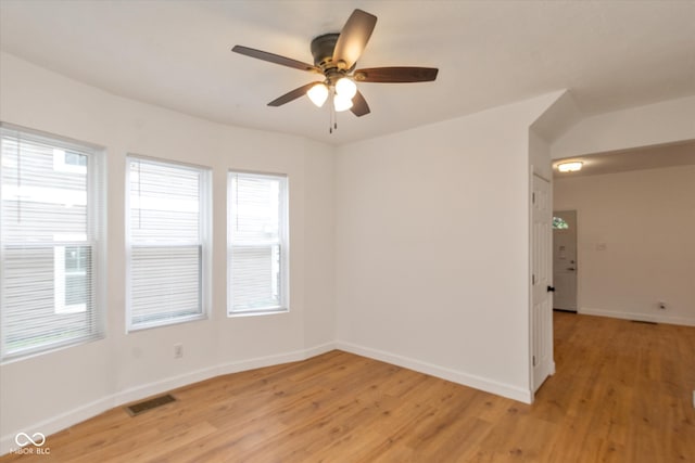 spare room featuring ceiling fan and light hardwood / wood-style flooring