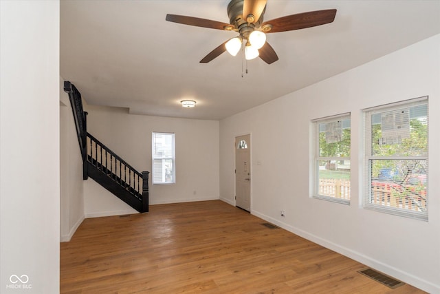 309 N Lasalle St, Indianapolis, IN 46201 - entrance foyer with light wood-style flooring, visible vents, baseboards, and stairway
