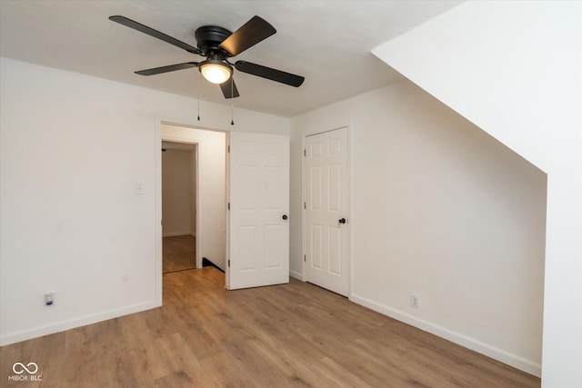 bonus room with light hardwood / wood-style floors and ceiling fan