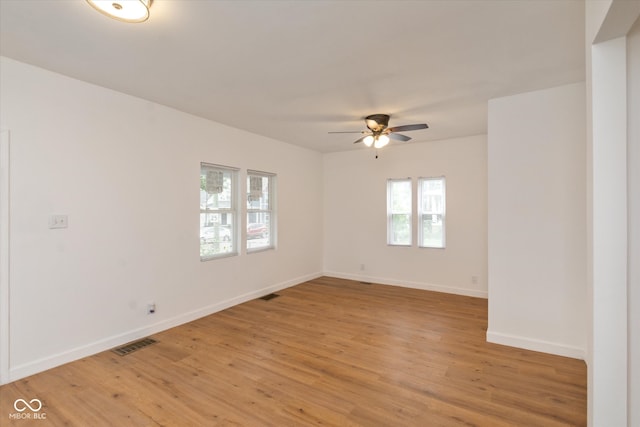 empty room featuring light hardwood / wood-style flooring and ceiling fan