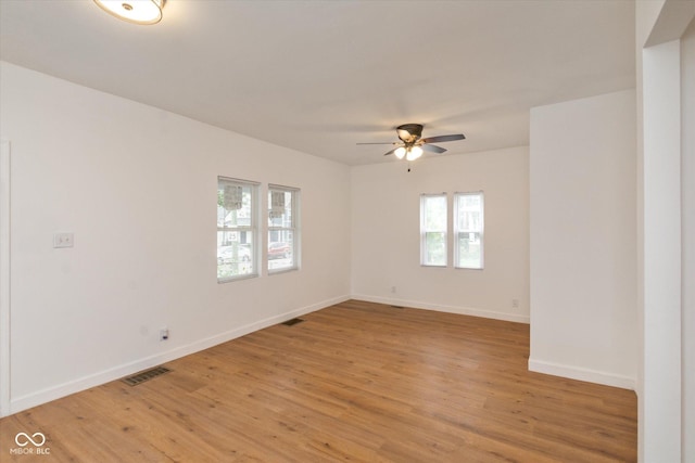 309 N Lasalle St, Indianapolis, IN 46201 - spare room with light wood-style floors, visible vents, baseboards, and ceiling fan