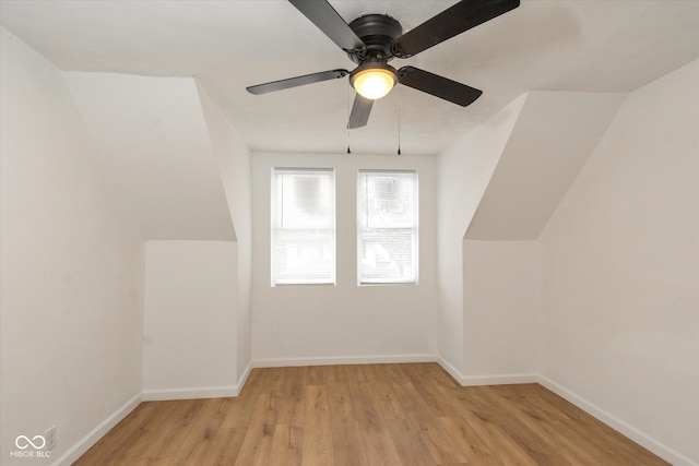 bonus room with light hardwood / wood-style floors, ceiling fan, and vaulted ceiling