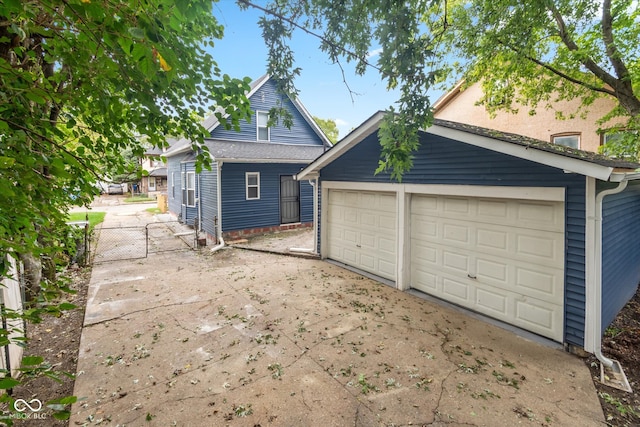 exterior space with an outdoor structure and a garage