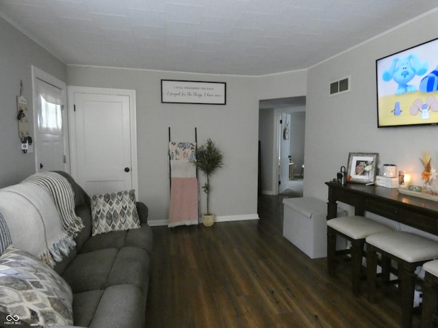 living room featuring crown molding and dark hardwood / wood-style flooring