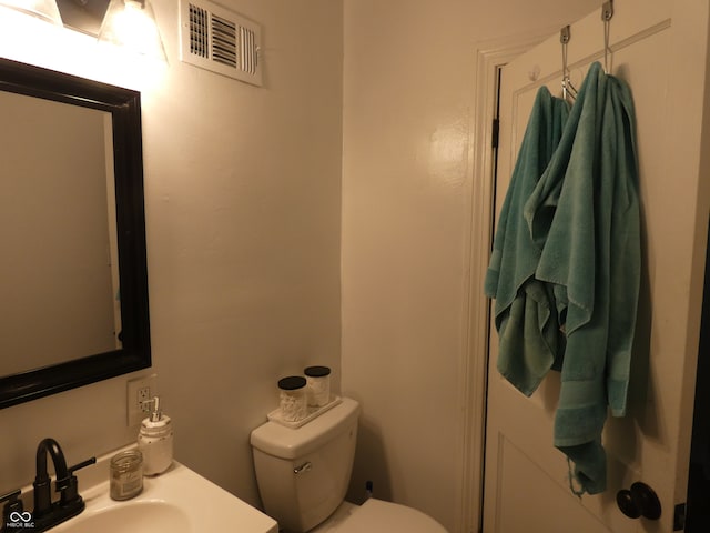 bathroom featuring sink and toilet