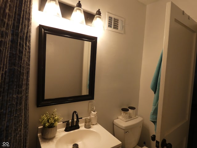 bathroom featuring sink and toilet