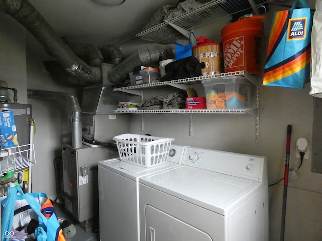 washroom featuring washer and clothes dryer