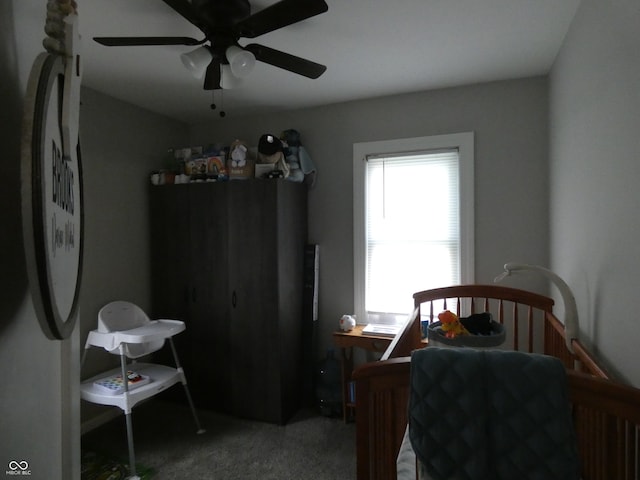 carpeted bedroom with ceiling fan