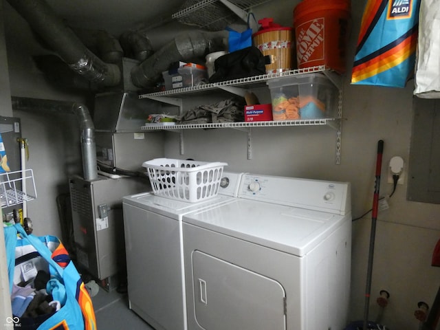 laundry area featuring separate washer and dryer and heating unit