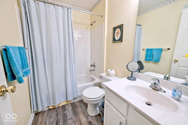 full bathroom featuring shower / tub combo with curtain, vanity, toilet, and hardwood / wood-style flooring