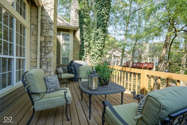 wooden terrace with area for grilling