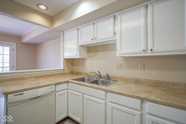 kitchen featuring a sink, white dishwasher, white cabinets, and light countertops