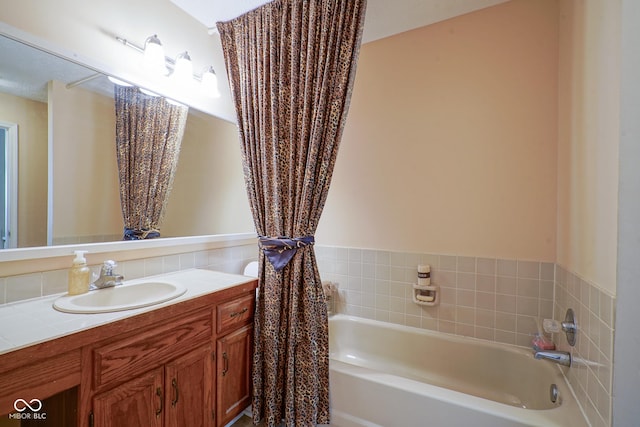 full bath with a garden tub and vanity