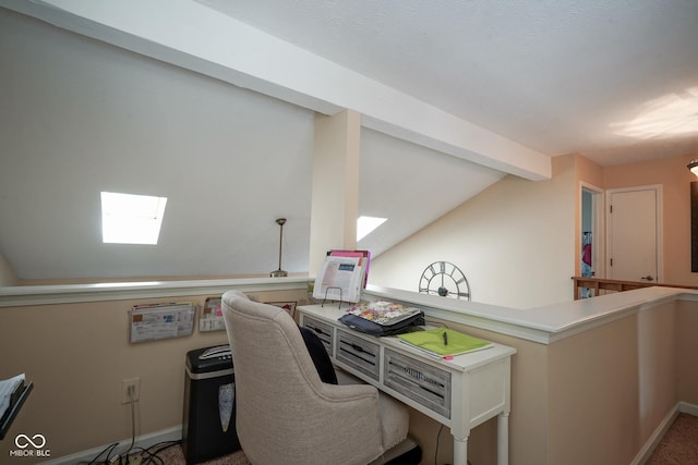 office space featuring lofted ceiling with beams and baseboards