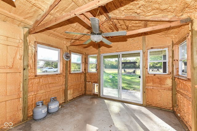 unfurnished sunroom featuring ceiling fan and vaulted ceiling