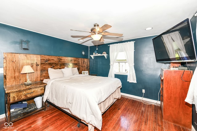 bedroom with ceiling fan and dark wood-type flooring