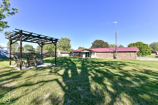 view of yard with a pergola and a patio area