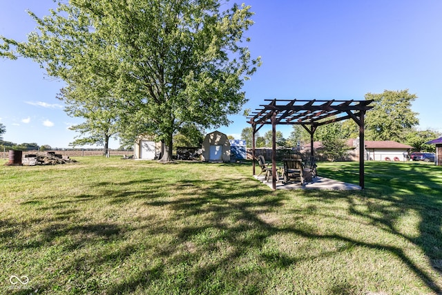 view of yard with a patio, a pergola, and a storage unit