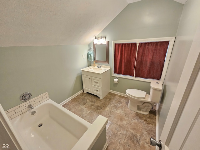 bathroom featuring vanity, toilet, a bathing tub, and vaulted ceiling