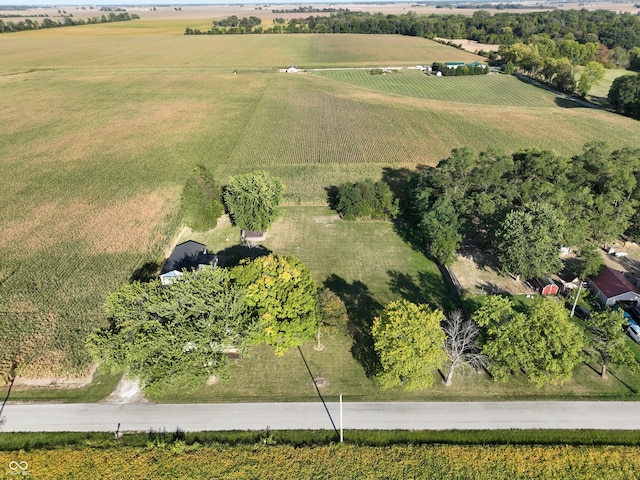 birds eye view of property with a rural view