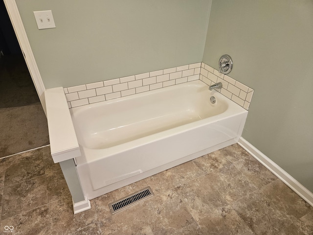 bathroom with a tub to relax in