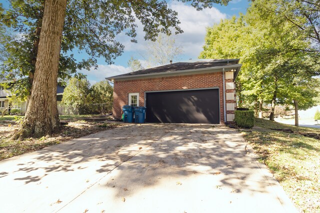 view of property exterior with a garage