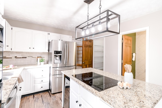 kitchen featuring light hardwood / wood-style flooring, hanging light fixtures, stainless steel refrigerator with ice dispenser, black electric stovetop, and white cabinets